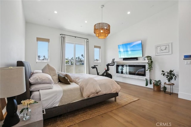 1926 Ruhland Ave Unit B, Redondo Beach, CA 90278 - bedroom with recessed lighting, wood finished floors, a glass covered fireplace, and baseboards