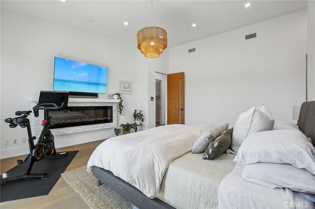 1926 Ruhland Ave Unit B, Redondo Beach, CA 90278 - bedroom with wood finished floors, recessed lighting, and a glass covered fireplace