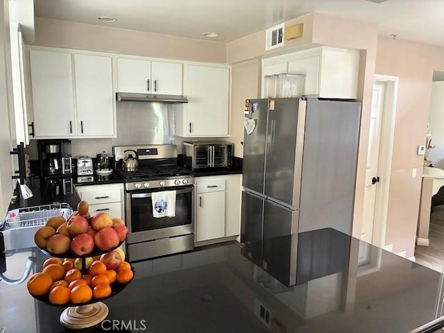 2249 Montrose Ave Unit 7, Montrose, CA 91020 - kitchen featuring stainless steel appliances, dark countertops, white cabinets, and under cabinet range hood