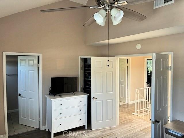 2249 Montrose Ave Unit 7, Montrose, CA 91020 - bedroom featuring light wood-style flooring, a towering ceiling, baseboards, and a ceiling fan