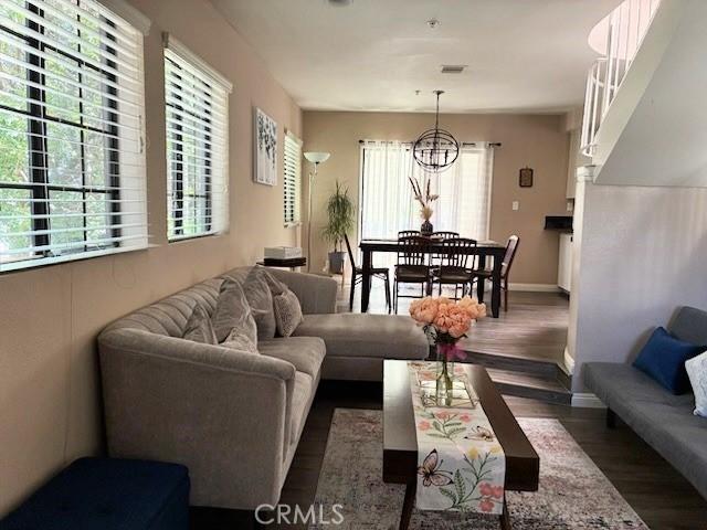 2249 Montrose Ave Unit 7, Montrose, CA 91020 - living area with a chandelier, wood finished floors, and baseboards