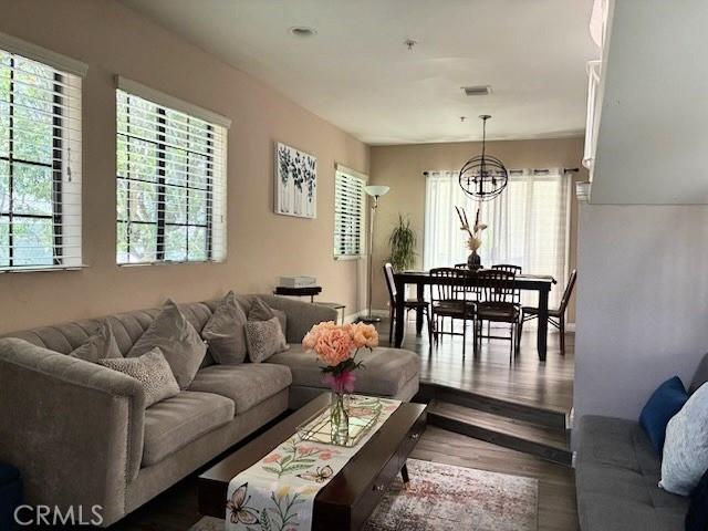 2249 Montrose Ave Unit 7, Montrose, CA 91020 - living area featuring wood finished floors, plenty of natural light, and a chandelier