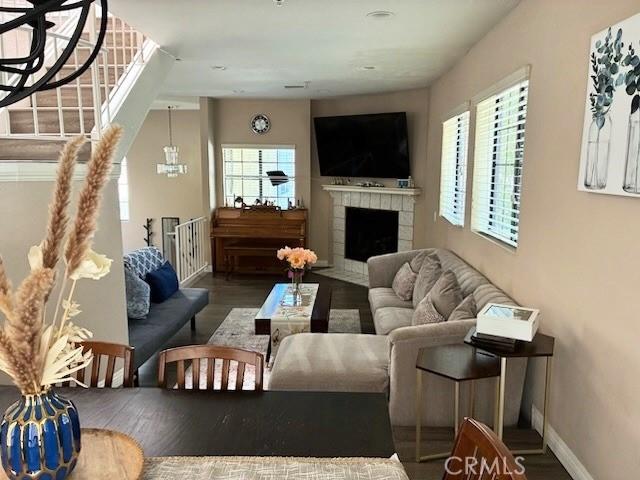 2249 Montrose Ave Unit 7, Montrose, CA 91020 - living room with healthy amount of natural light, wood finished floors, a tile fireplace, and baseboards