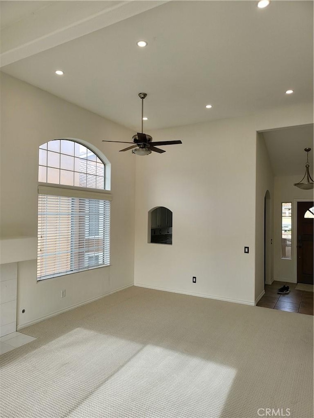 23 Gauguin Cir, Aliso Viejo, CA 92656 - unfurnished living room with carpet flooring, arched walkways, recessed lighting, healthy amount of natural light, and ceiling fan