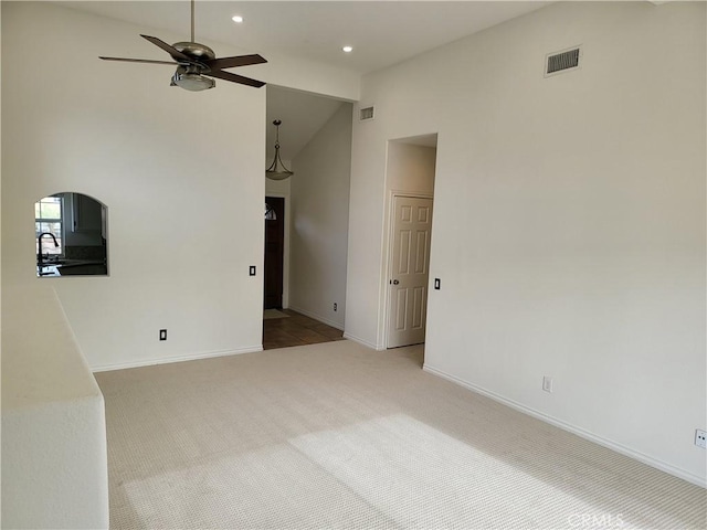 23 Gauguin Cir, Aliso Viejo, CA 92656 - unfurnished living room with a ceiling fan, carpet flooring, baseboards, recessed lighting, and high vaulted ceiling