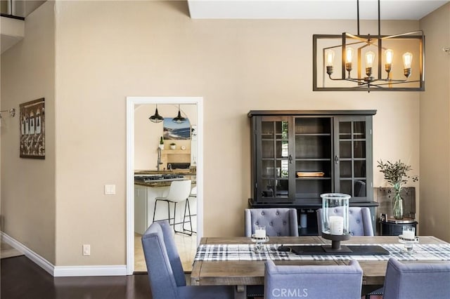 31291 Via Fajita, San Juan Capistrano, CA 92675 - dining space with a chandelier, baseboards, and wood finished floors
