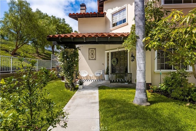 31291 Via Fajita, San Juan Capistrano, CA 92675 - entrance to property with stucco siding, a tiled roof, and covered porch
