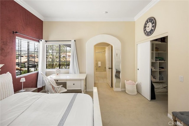 31291 Via Fajita, San Juan Capistrano, CA 92675 - bedroom with arched walkways, crown molding, light carpet, ensuite bathroom, and baseboards