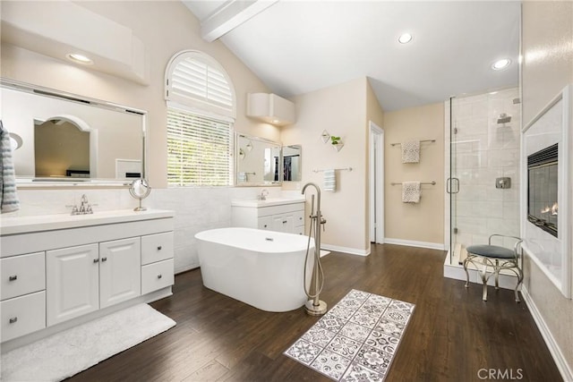 31291 Via Fajita, San Juan Capistrano, CA 92675 - full bath featuring a stall shower, two vanities, a freestanding bath, wood finished floors, and recessed lighting
