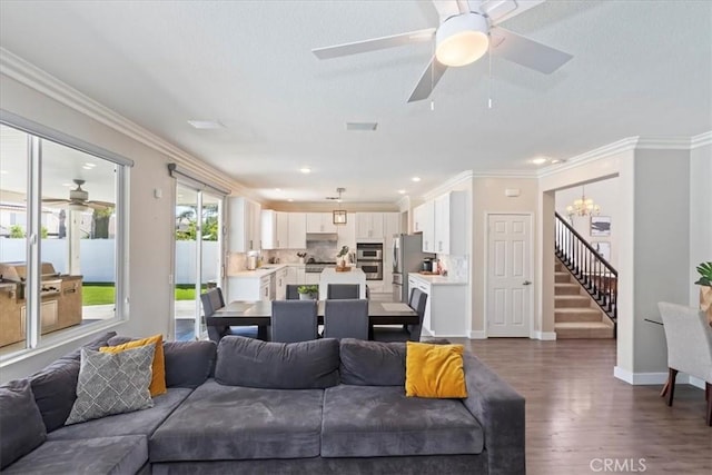 26273 Palm Tree Ln, Murrieta, CA 92563 - living area with stairs, dark wood-style flooring, a ceiling fan, a chandelier, and baseboards