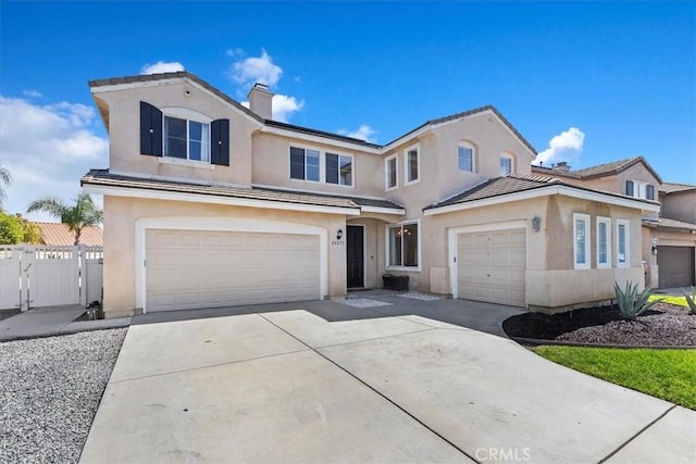26273 Palm Tree Ln, Murrieta, CA 92563 - traditional home featuring stucco siding, driveway, a chimney, an attached garage, and a gate