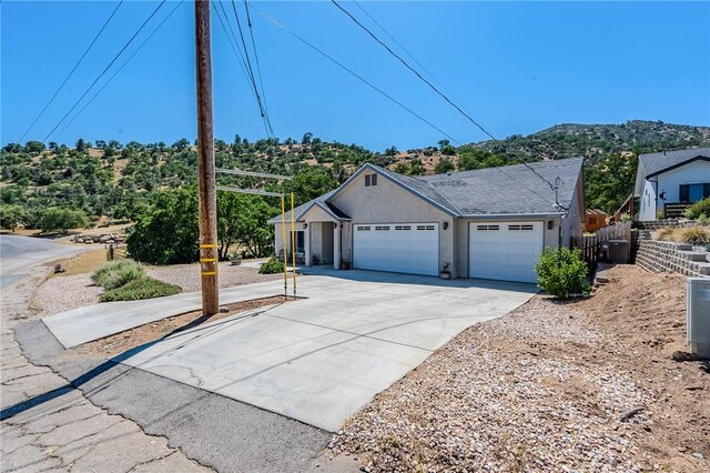 21604 Adam Dr, Tehachapi, CA 93561 - single story home featuring an attached garage, concrete driveway, and stucco siding