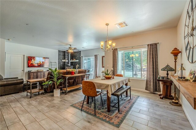 21604 Adam Dr, Tehachapi, CA 93561 - dining space featuring light wood-style flooring, a chandelier, ceiling fan, and baseboards