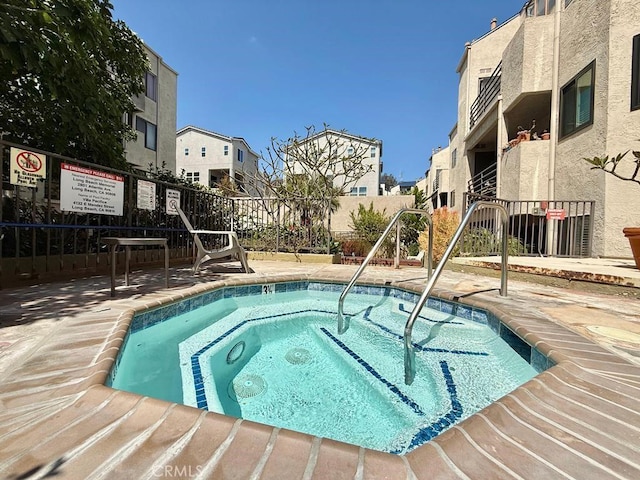 4142 E Mendez St Unit 132, Long Beach, CA 90815 - view of swimming pool with a pool, a community hot tub, a residential view, and a patio area
