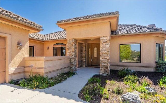 570 Jenny Pl, Arroyo Grande, CA 93420 - doorway to property featuring a tiled roof and stucco siding