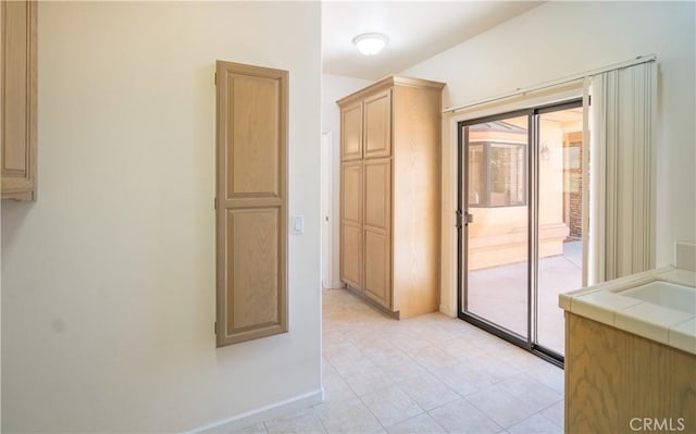 570 Jenny Pl, Arroyo Grande, CA 93420 - empty room with baseboards, light tile patterned floors, and a sink