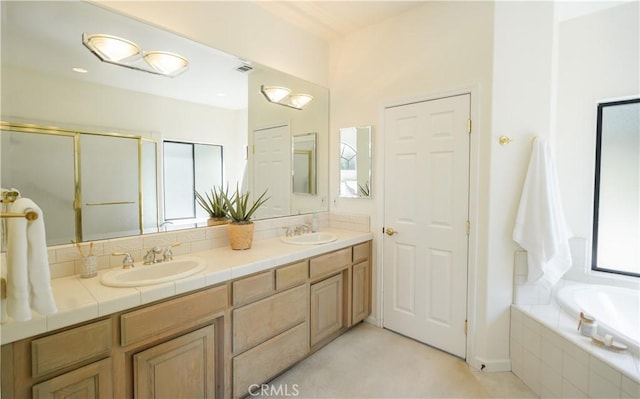 570 Jenny Pl, Arroyo Grande, CA 93420 - full bathroom with double vanity, a garden tub, and a shower with door