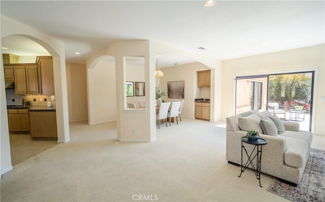 570 Jenny Pl, Arroyo Grande, CA 93420 - living area with light colored carpet, recessed lighting, arched walkways, and baseboards