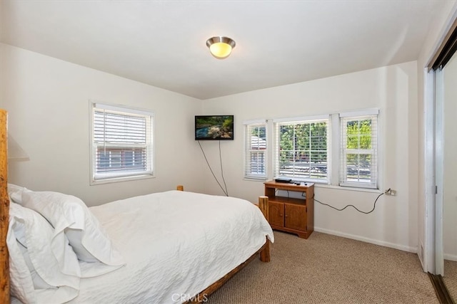 681 Chipmunk Ln, Big Bear Lake, CA 92315 - bedroom with light carpet, multiple windows, and baseboards