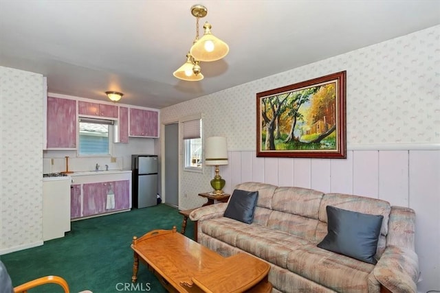 681 Chipmunk Ln, Big Bear Lake, CA 92315 - living room with wallpapered walls, a wainscoted wall, and dark colored carpet