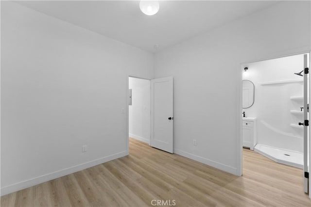 752 E 17th St, Los Angeles, CA 90021 - unfurnished bedroom featuring light wood-type flooring and baseboards