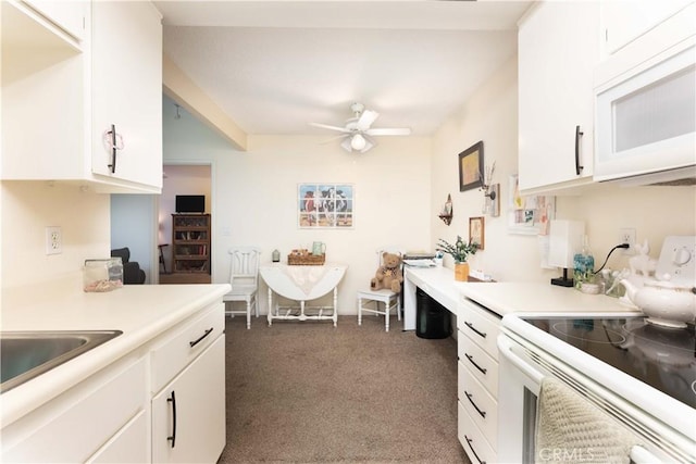 20702 El Toro Rd Unit 6, Lake Forest, CA 92630 - kitchen with white appliances, dark carpet, light countertops, ceiling fan, and white cabinetry