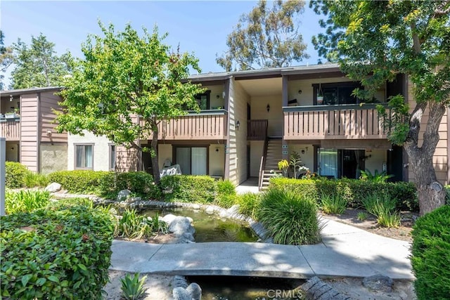 20702 El Toro Rd Unit 6, Lake Forest, CA 92630 - view of building exterior with a small pond and stairs