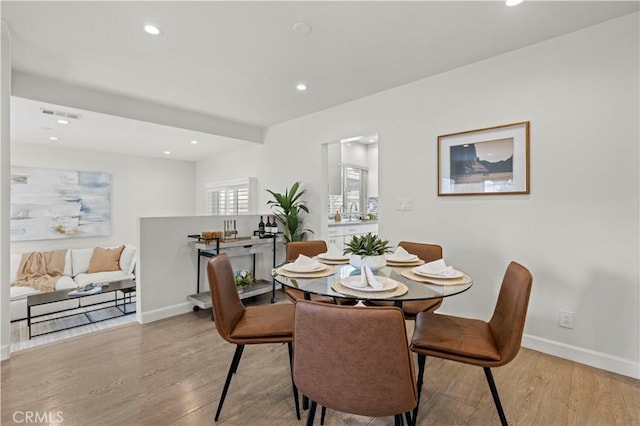 5834 Satsuma Ave, North Hollywood, CA 91601 - dining area with wood finished floors, recessed lighting, and baseboards