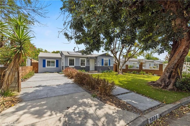 5834 Satsuma Ave, North Hollywood, CA 91601 - ranch-style house with stucco siding, driveway, and roof mounted solar panels
