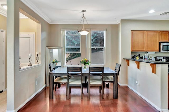 4300 Newton Ave Unit 110, San Diego, CA 92113 - dining space featuring dark wood finished floors, ornamental molding, and baseboards
