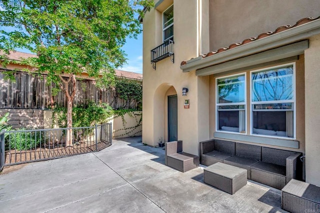 4300 Newton Ave Unit 110, San Diego, CA 92113 - fenced backyard with a patio area, an outdoor hangout area, and a balcony
