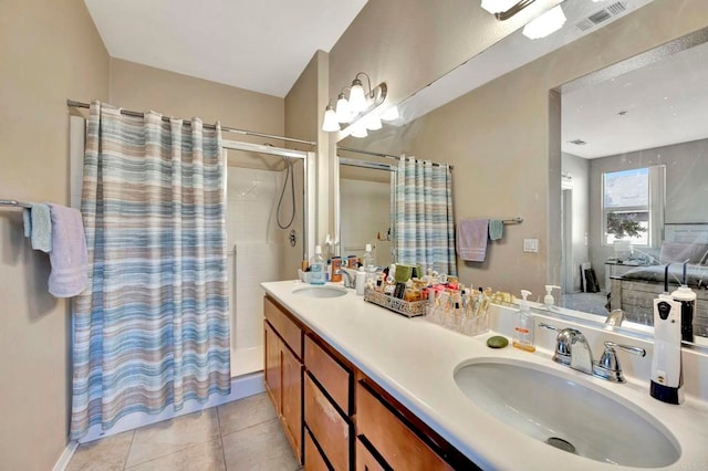 4300 Newton Ave Unit 110, San Diego, CA 92113 - full bath with a shower with shower curtain, double vanity, and tile patterned floors