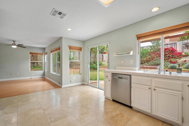 513 Shadow Tree Dr, Oceanside, CA 92058 - kitchen with dishwasher, tile countertops, plenty of natural light, and recessed lighting