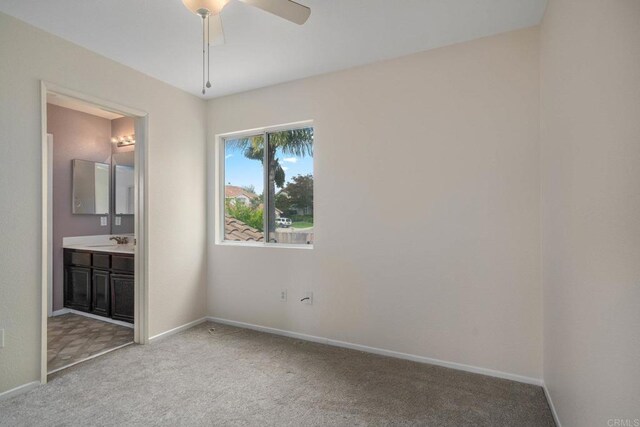 513 Shadow Tree Dr, Oceanside, CA 92058 - unfurnished bedroom featuring carpet floors, a sink, baseboards, and ensuite bathroom