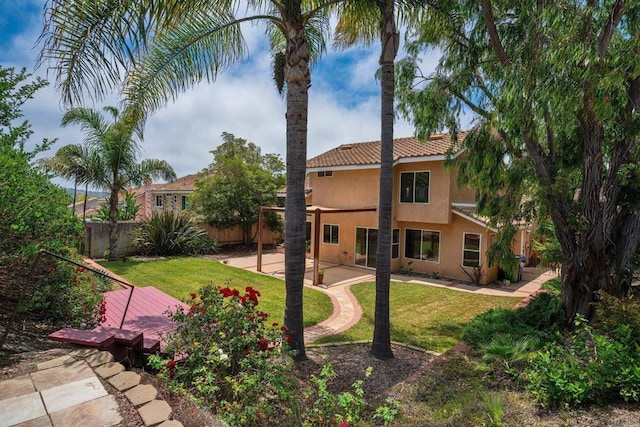 513 Shadow Tree Dr, Oceanside, CA 92058 - back of house featuring stucco siding, a tiled roof, and a patio area