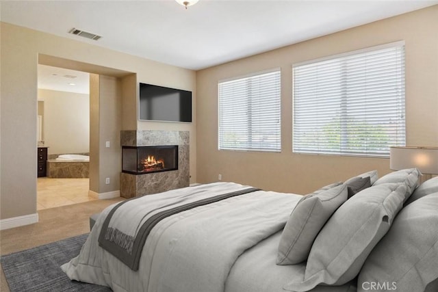 4224 Oliphant Ct, Riverside, CA 92505 - bedroom with carpet flooring, a multi sided fireplace, baseboards, and ensuite bathroom