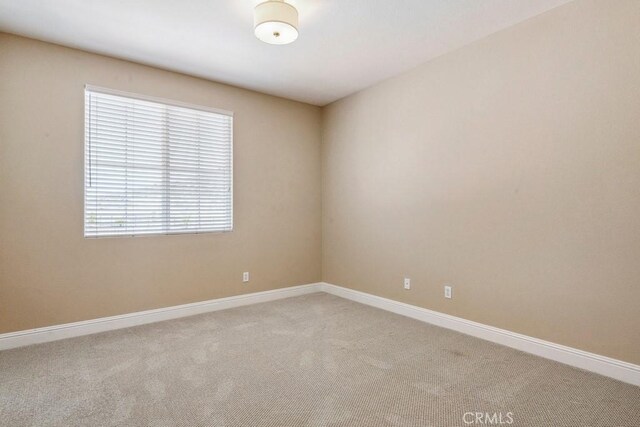 4224 Oliphant Ct, Riverside, CA 92505 - carpeted empty room with baseboards