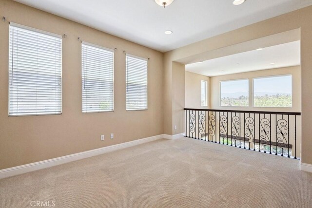 4224 Oliphant Ct, Riverside, CA 92505 - unfurnished room featuring carpet flooring, plenty of natural light, baseboards, and recessed lighting
