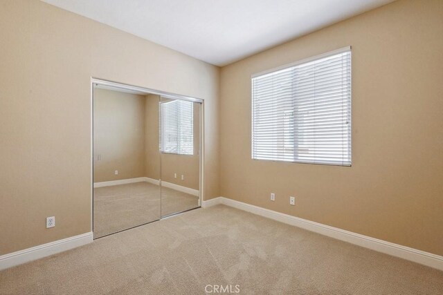 4224 Oliphant Ct, Riverside, CA 92505 - unfurnished bedroom with carpet floors, a closet, and baseboards