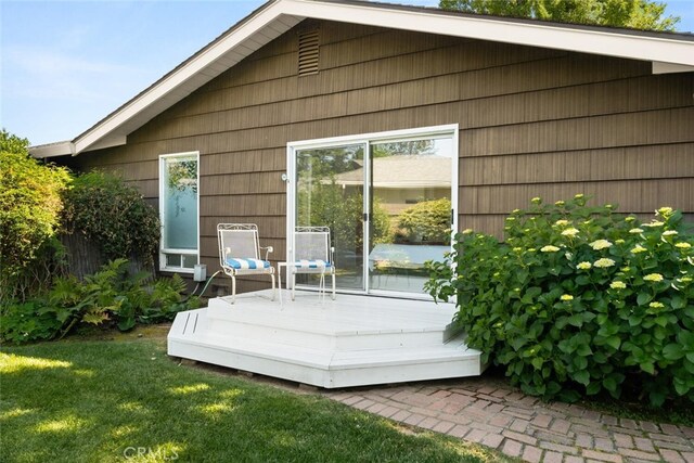 1671 Plumas Way, Chico, CA 95926 - back of property featuring a deck and a yard