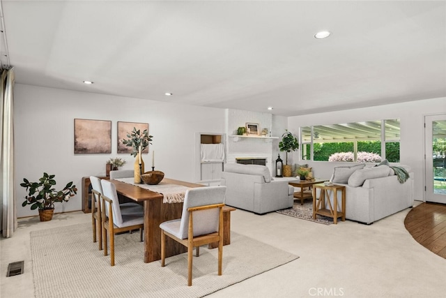 1671 Plumas Way, Chico, CA 95926 - dining area featuring recessed lighting, plenty of natural light, a fireplace, and light carpet