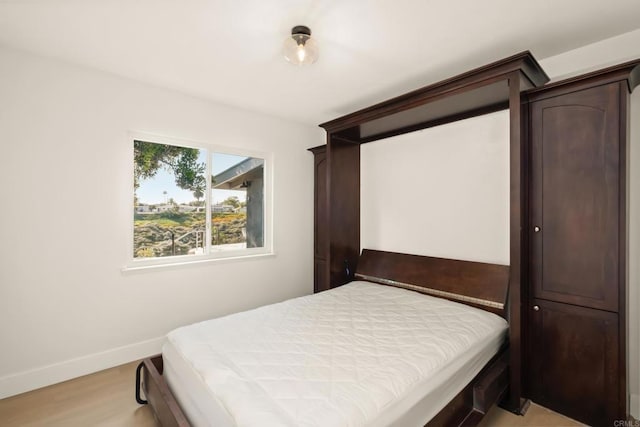 4158 Seri St, San Diego, CA 92117 - bedroom with light wood-style flooring and baseboards