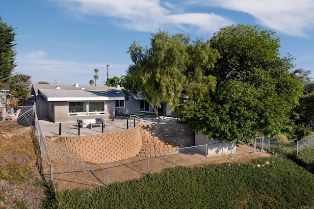 4158 Seri St, San Diego, CA 92117 - back of house featuring a patio, stucco siding, and a fenced backyard
