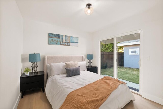 4158 Seri St, San Diego, CA 92117 - bedroom with access to exterior, baseboards, and wood finished floors