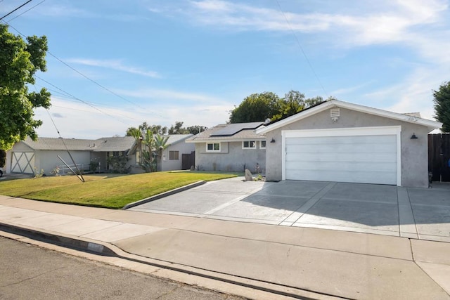 4158 Seri St, San Diego, CA 92117 - ranch-style home with roof mounted solar panels, a front lawn, driveway, stucco siding, and an attached garage