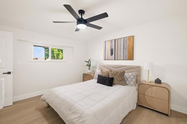 4158 Seri St, San Diego, CA 92117 - bedroom with baseboards, wood finished floors, and a ceiling fan
