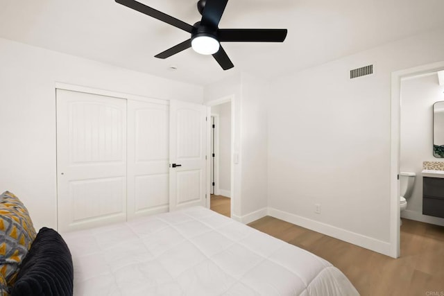 4158 Seri St, San Diego, CA 92117 - bedroom featuring wood finished floors, baseboards, a closet, ensuite bath, and a ceiling fan