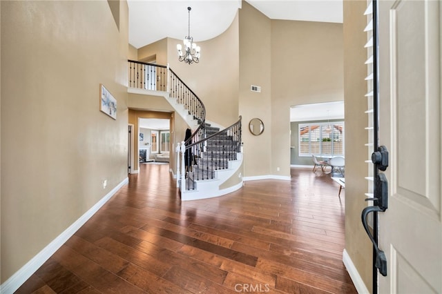 16139 Crooked Creek Ct, Chino Hills, CA 91709 - foyer entrance featuring hardwood / wood-style floors, a chandelier, high vaulted ceiling, baseboards, and stairway