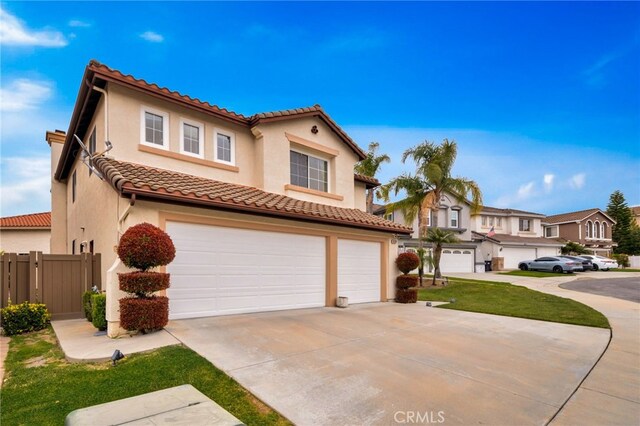16139 Crooked Creek Ct, Chino Hills, CA 91709 - mediterranean / spanish-style house featuring a garage, a tile roof, driveway, and stucco siding