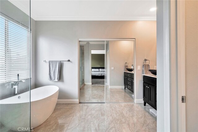 16139 Crooked Creek Ct, Chino Hills, CA 91709 - full bathroom with vanity, a freestanding tub, crown molding, marble look tiles, and ensuite bathroom